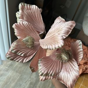 Three faux flowers, pink stems